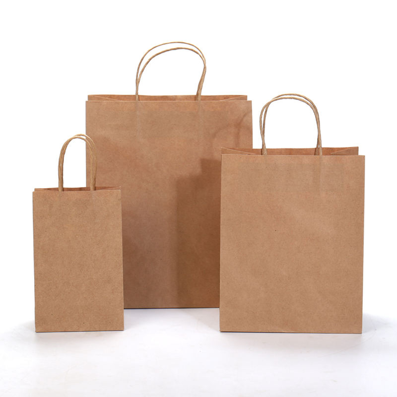 Factory-customized kraft paper bags with handles; color options available.