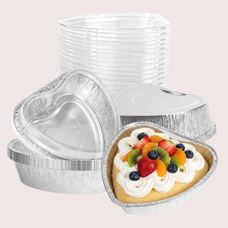 Christmas-themed heart-shaped aluminum foil dessert containers with lids, suitable for holiday treats.