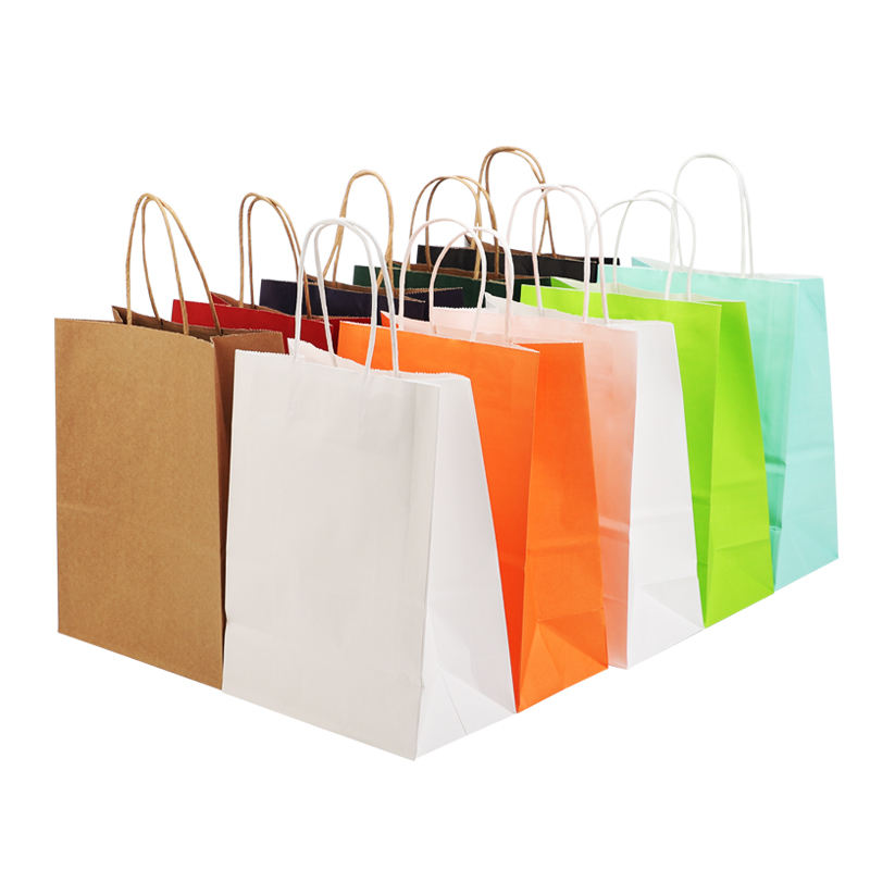 Factory-customized kraft paper bags with handles; color options available.