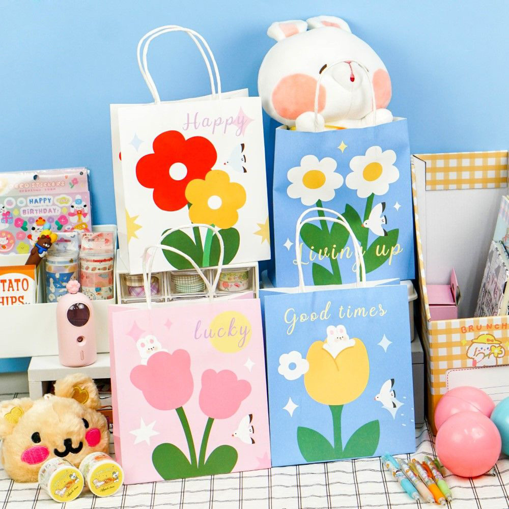 Customizable floral-print, biodegradable, eco-friendly kraft paper bags featuring colorful logos and sturdy handles; suitable for craft retail, parties, and weddings.
