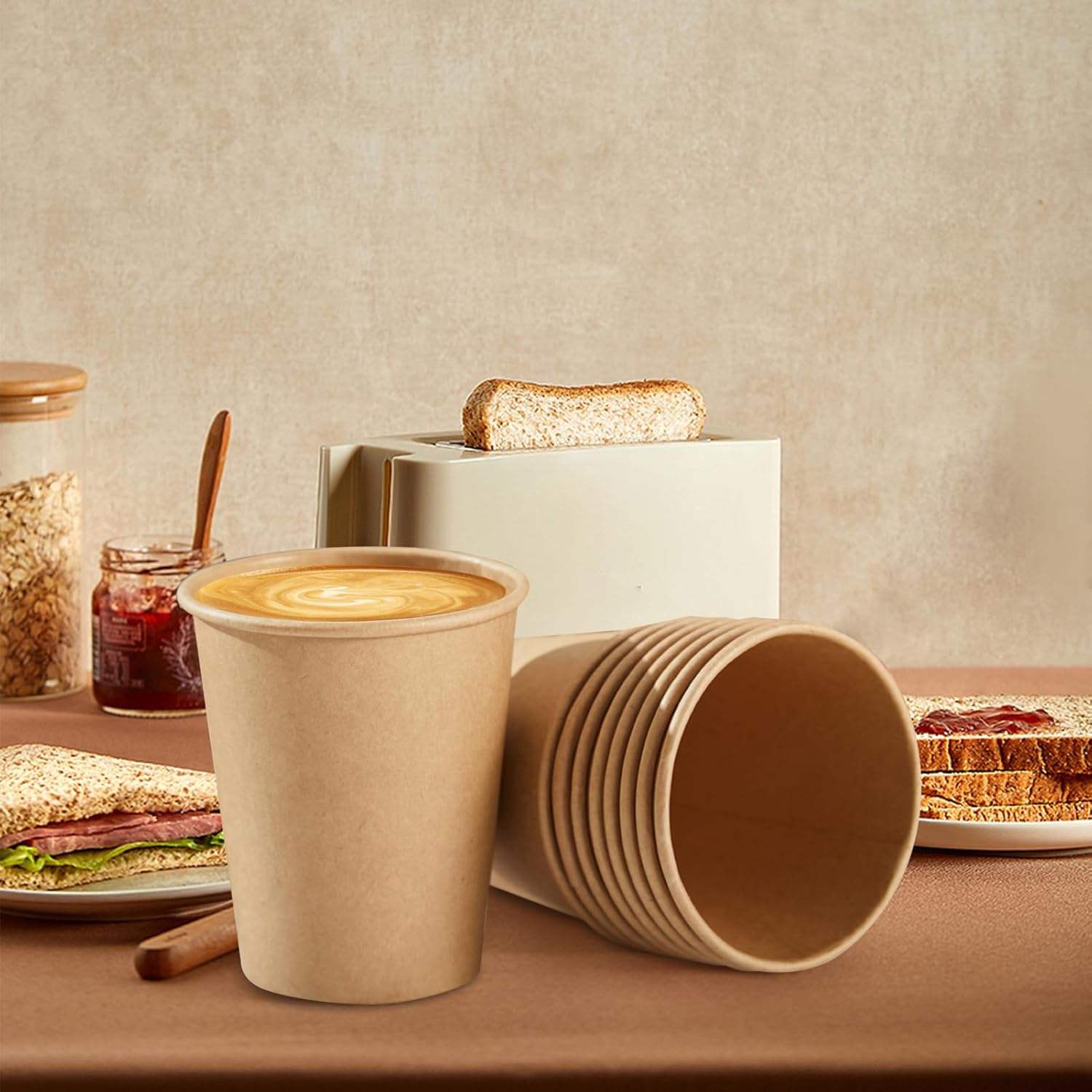 Custom-printed disposable double-wall paper cups for hot drinks—suitable for milk tea and coffee—with lids.