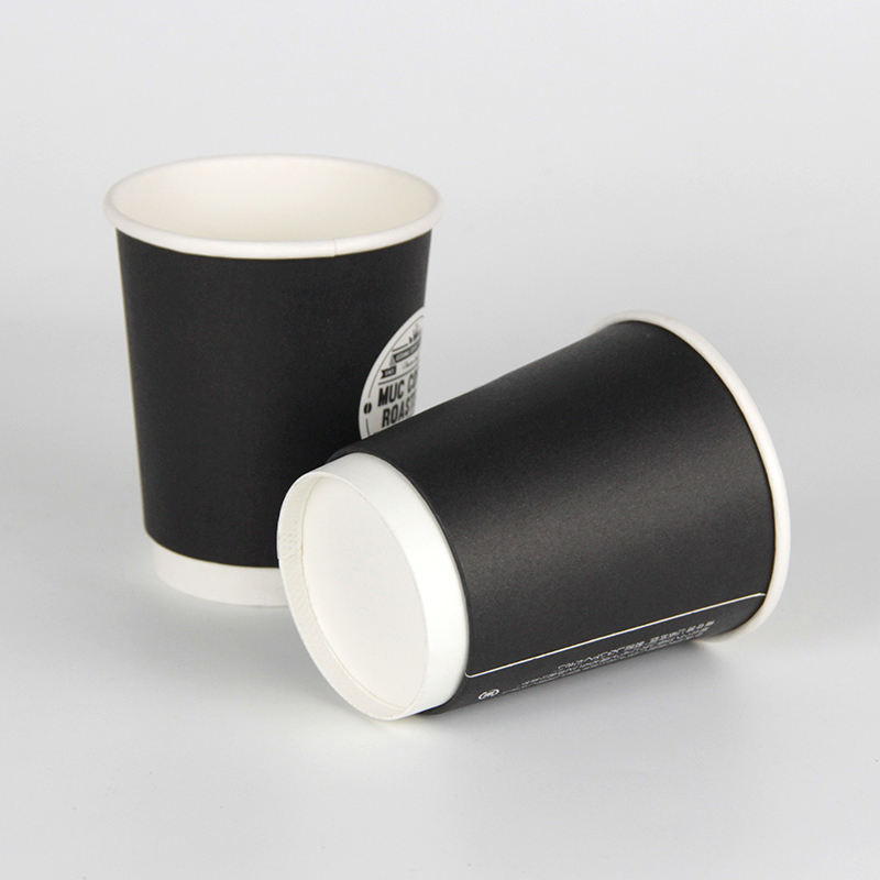 Double-wall, food-grade, thick disposable paper cups—custom printed with logos—suitable for hot drinks.