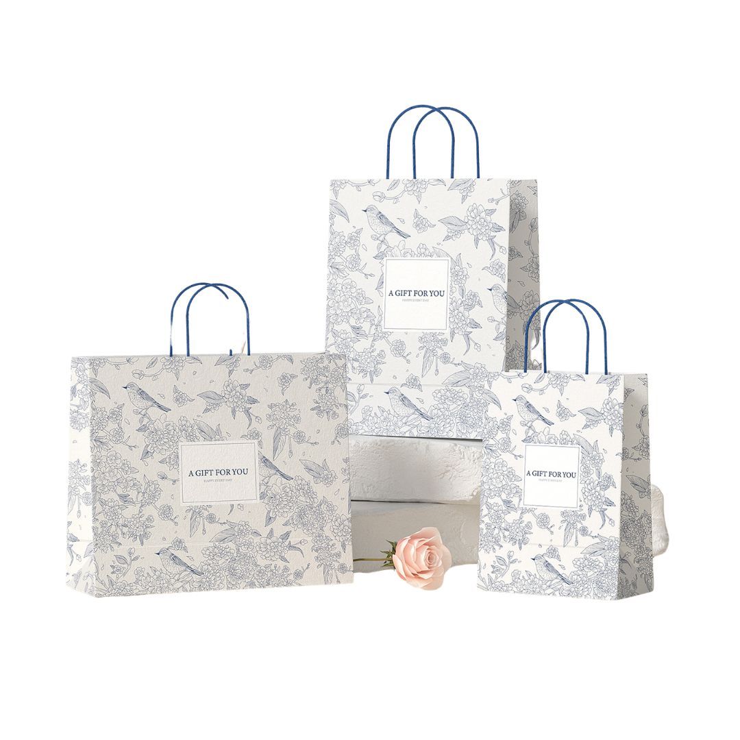 Elegant Chinese-style kraft paper gift bag with blue print; custom premium shopping bag with handles for packaging.